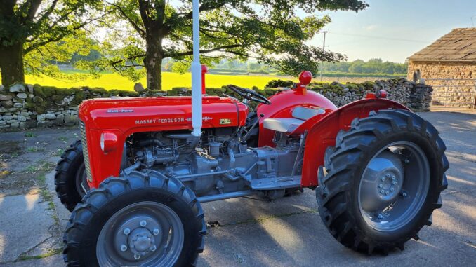 A red Massey Ferguson 35X Multi-Power tractor